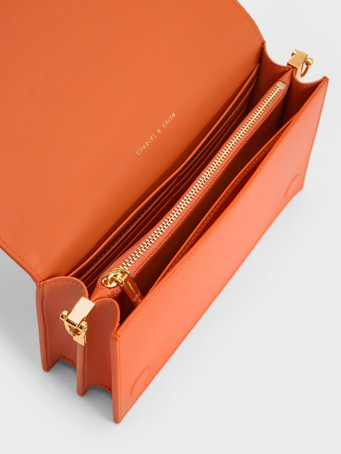 Orange clutch bag next top