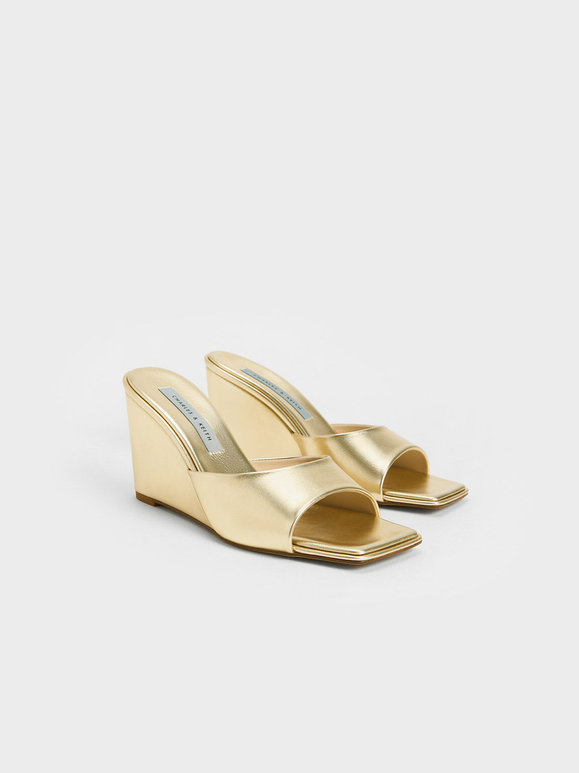 Gold wedge heels sales