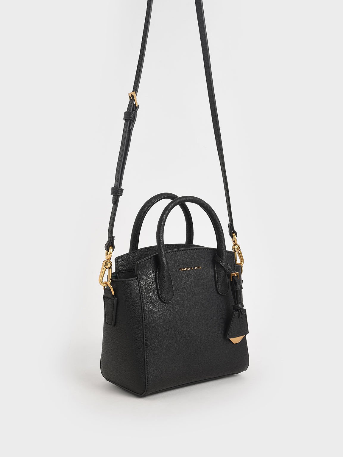 Charles & keith discount structured trapeze bag