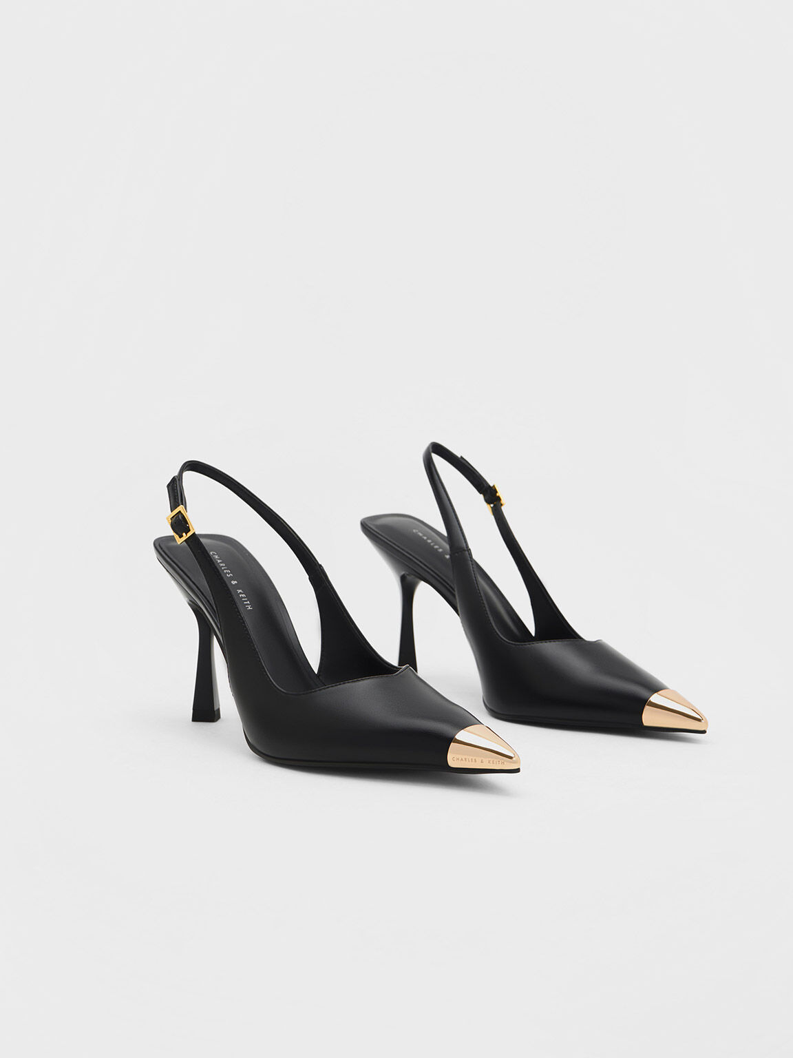 Black Buckled 50 point-toe faux-leather slingback pumps | Ganni | MATCHES UK