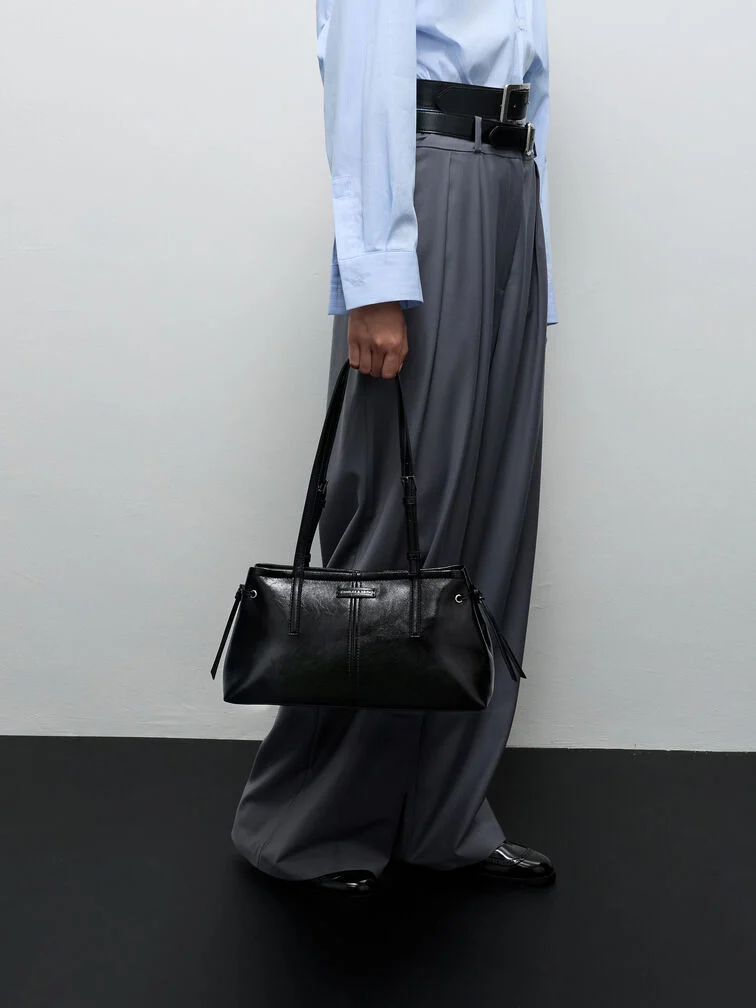 A collared shirt paired with trousers and styled with Mary Janes for an outfit that is ideal for networking events.