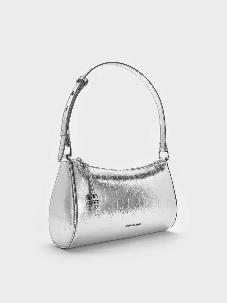 Metallic shoulder bag with sculptural details, perfect for the modern, style-savvy mum.