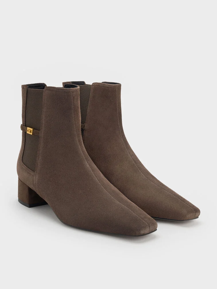 Dark brown suede ankle boots, a versatile footwear choice for fall. 