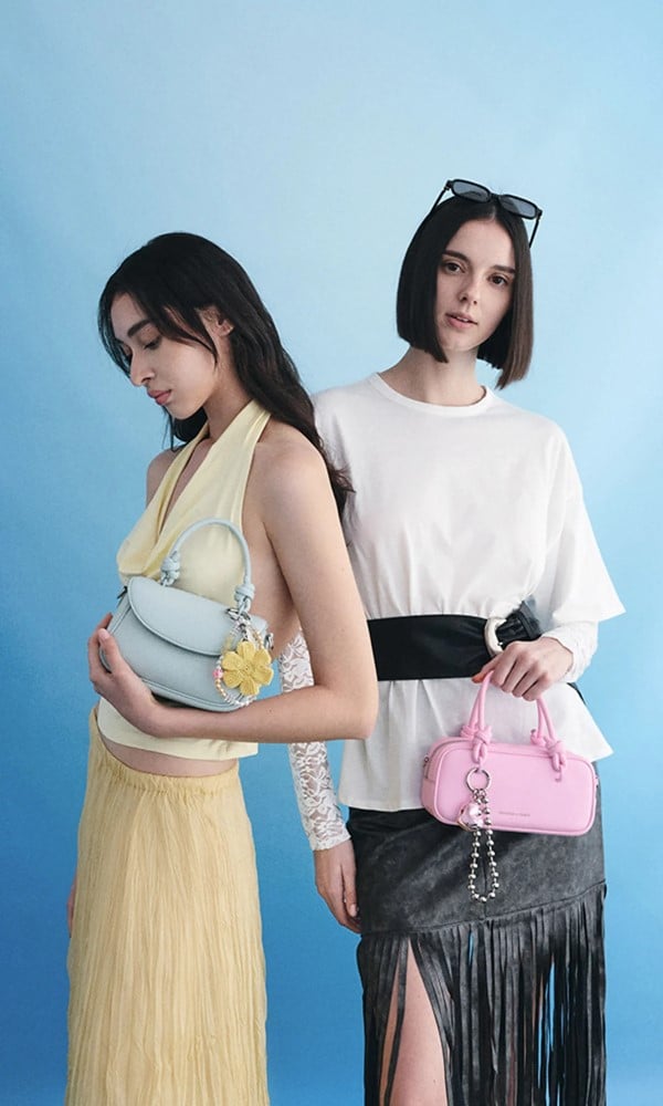 Bubblegum pink Sammie Knotted-Handle Elongated Bag; Sea Salt Blue Sammie Knotted-Handle Front-Flap Bag and Butter Yellow Crochet Flower Beaded Charm - CHARLES & KEITH