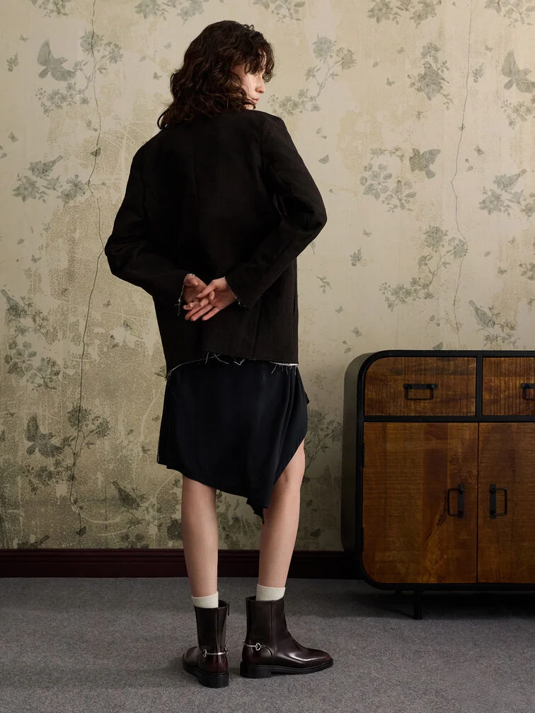 Burgundy side-zip ankle boots paired with an all-black outfit - CHARLES & KEITH