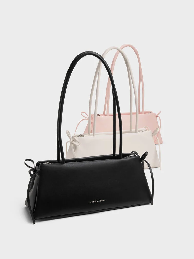 Black, white and soft pink Hazel East-West bags with bow details, made for the girly girls.