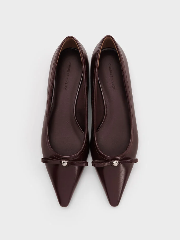Maroon pointed-toe ballet flats, a stylish alternative to heels that remains wedding-appropriate. 
