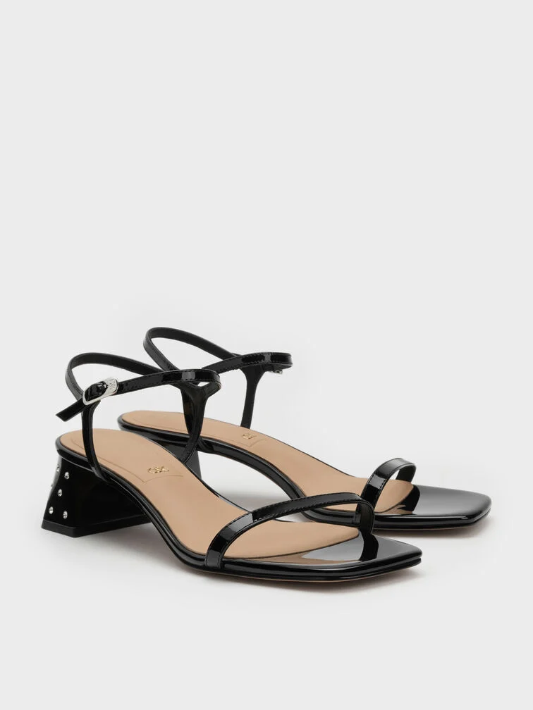 Patent leather sandals with crystal-embellished heels are a seasonally appropriate option.
