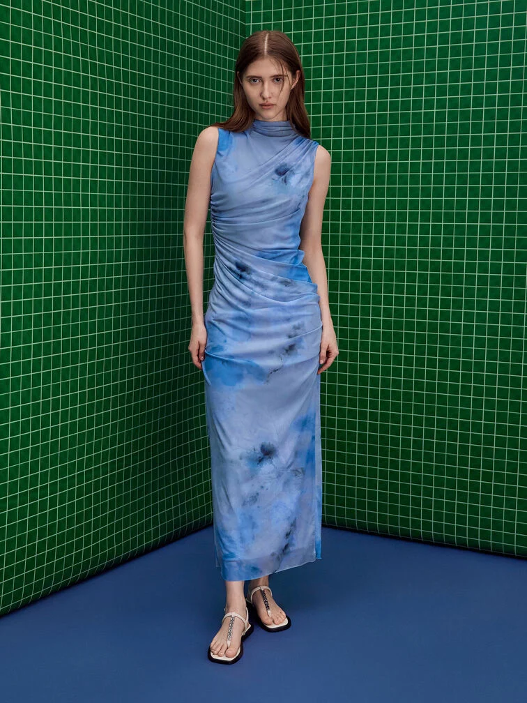 Blue printed dress styled with thong sandals. 