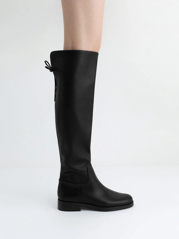 Black over-the-knee boots are perfectly suitable for October and November weddings.