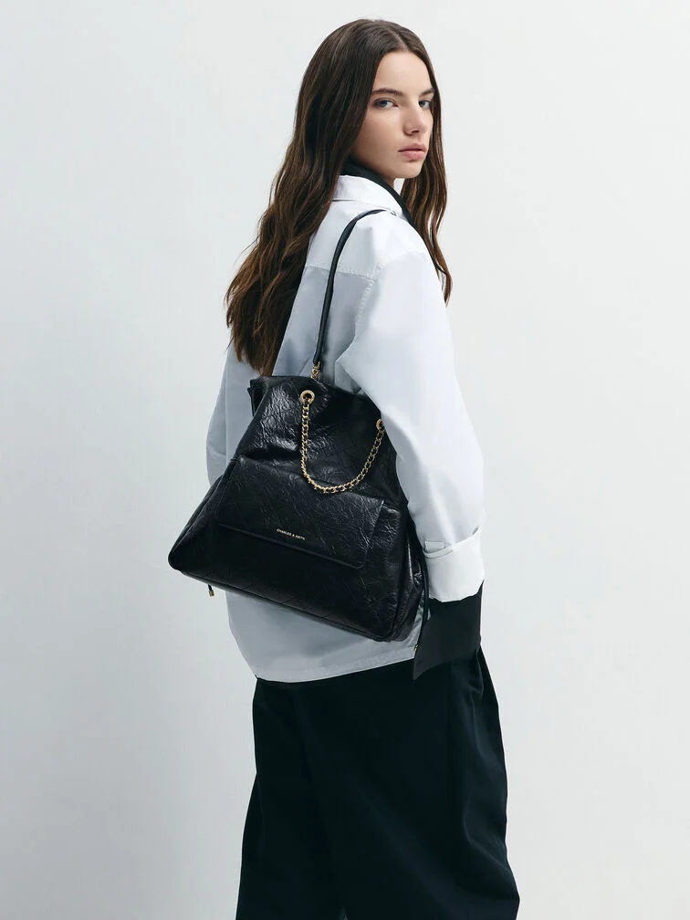 A collared white shirt styled with a maxi skirt in a failsafe monochromatic palette.