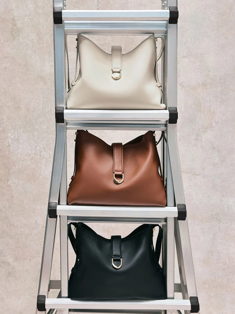 Leather belted hobo bags in versatile neutrals are memorable investment pieces, perfect for Christmas gifting.