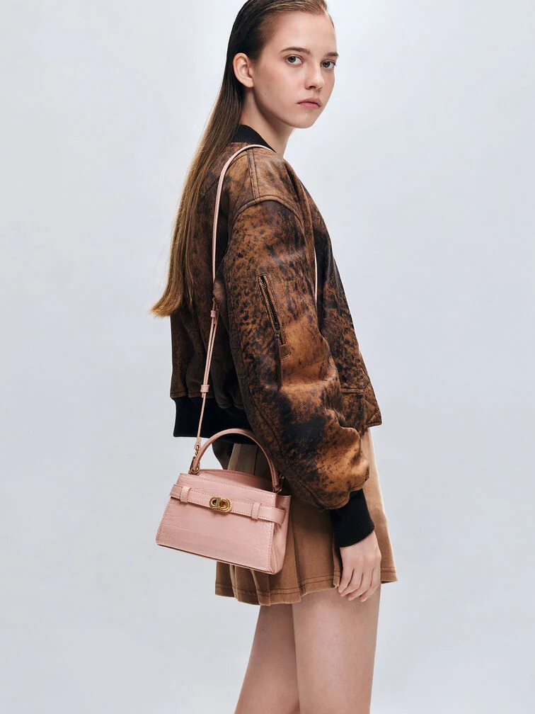 Women’s Aubrielle croc-effect top-handle bag, one of CHARLES & KEITH’s best-selling party bags. 