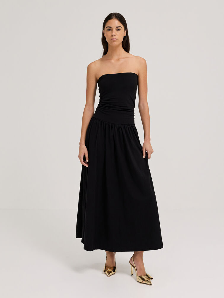 Pointed-toe slingback pumps styled with an evening dress, ideal for formal events.