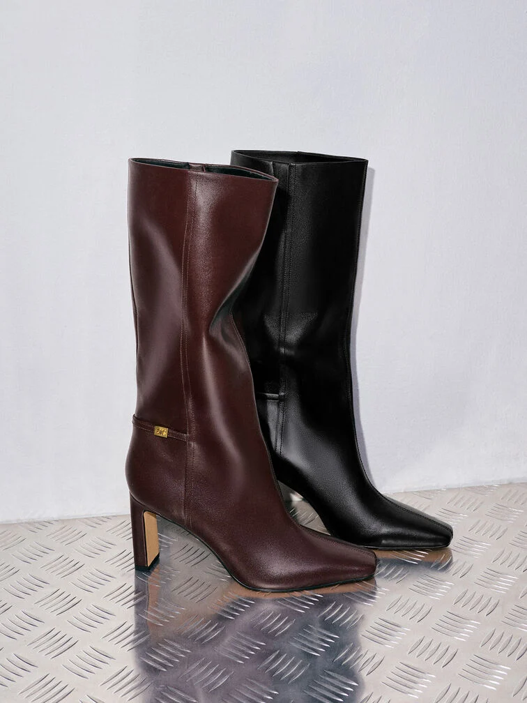 Leather knee-high boots, an elevated choice for formal fall occasions.