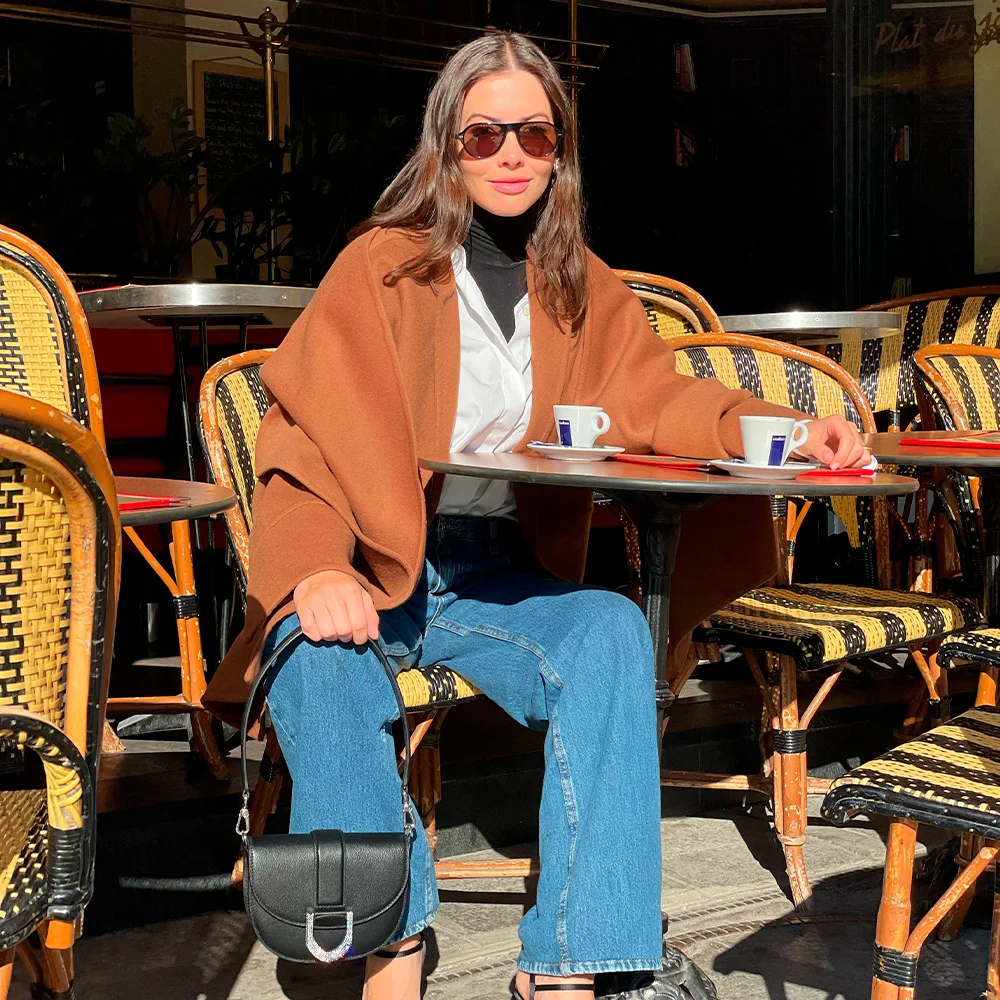 Kat Collings with the Gabine shoulder bag at Paris Fashion Week.