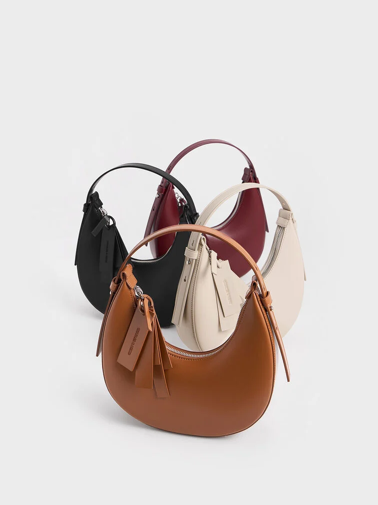 Everyday crescent bags in neutral shades are a thoughtful Christmas gift for moms.