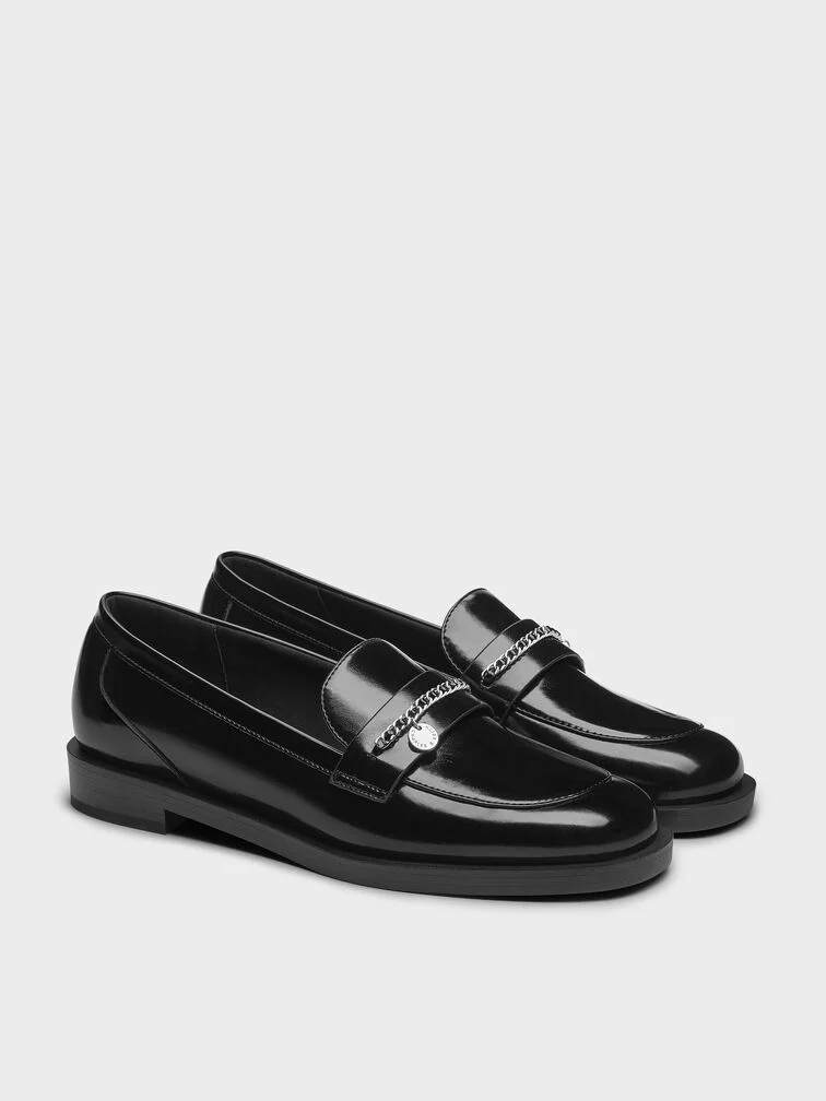 Black loafers with braided chain accents, a gift any mum will love. 