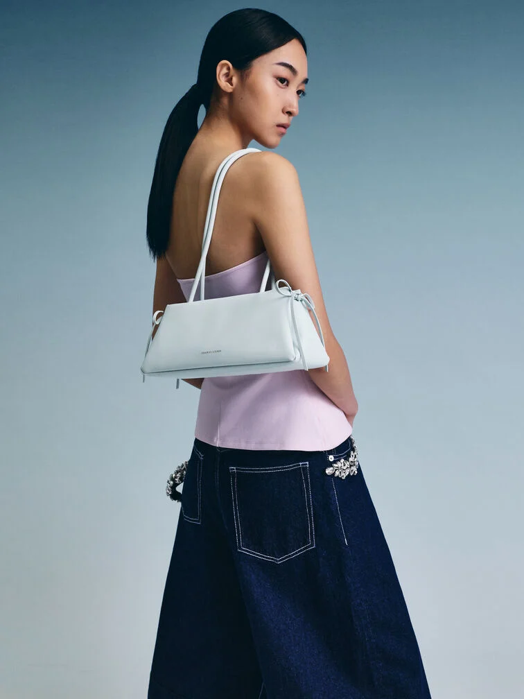 Sea salt blue Hazel East-West bag with dainty bow details.