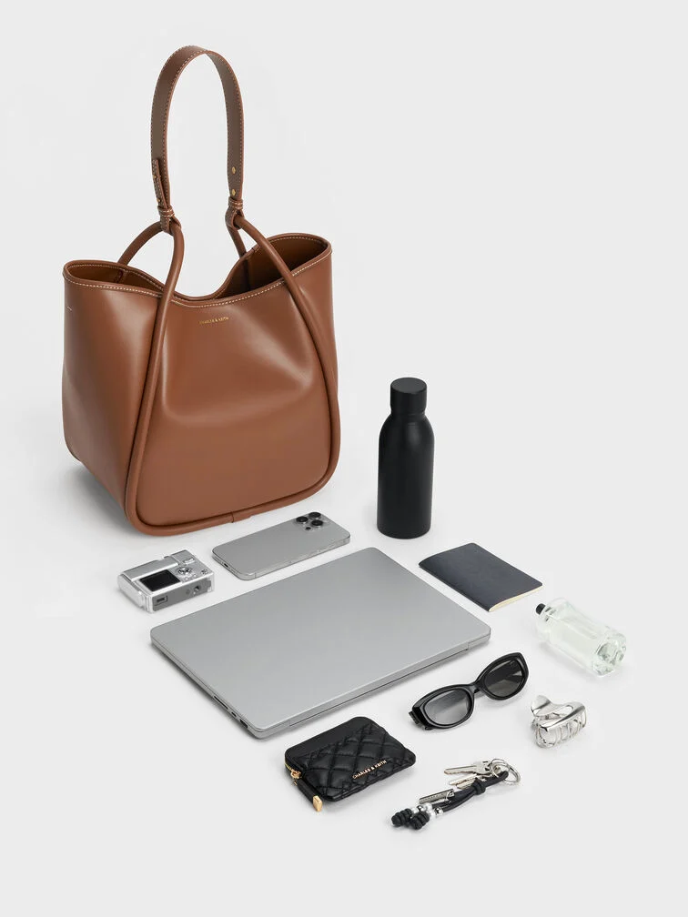 Slouchy tote bag in chocolate brown, the perfect choice for university students