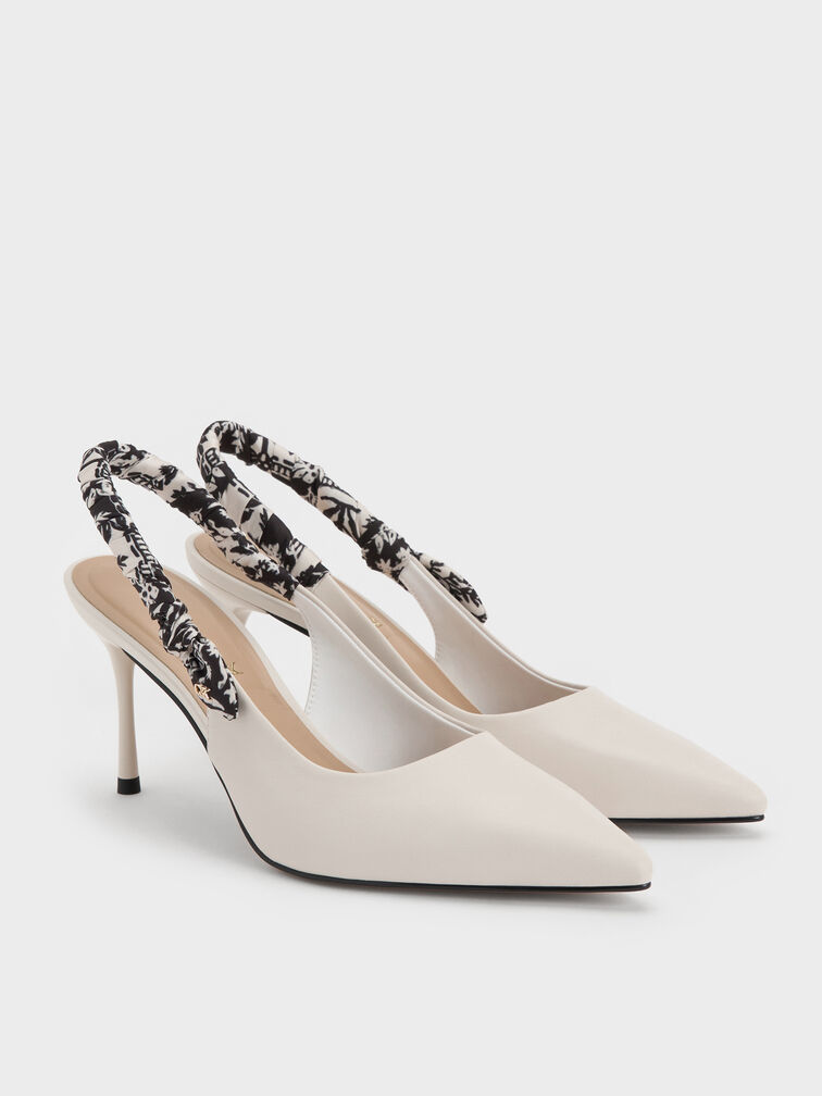 Slingback heels with eye-catching fabric-wrapped straps make a quiet statement while remaining polished and sophisticated. 