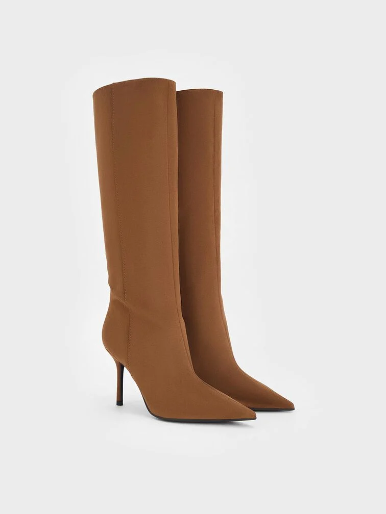  Pointed stiletto-heel boots in warm cognac brown are a great alternative to black boots for the colder months — they are especially apt for fall. 